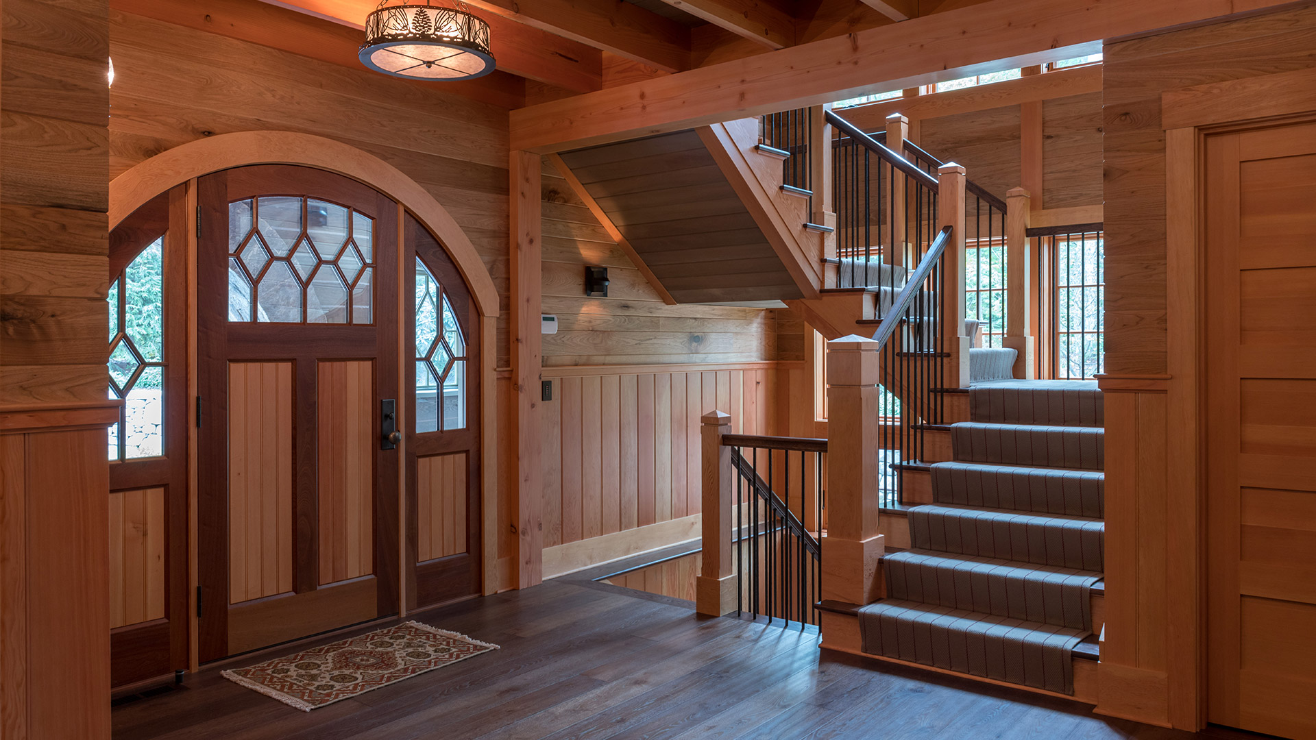 Alton, New Hampshire arched entry door and custom staircase