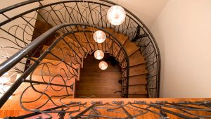 Lake Wentworth, New Hampshire custom curved stair with metal vines baluster and handrail
