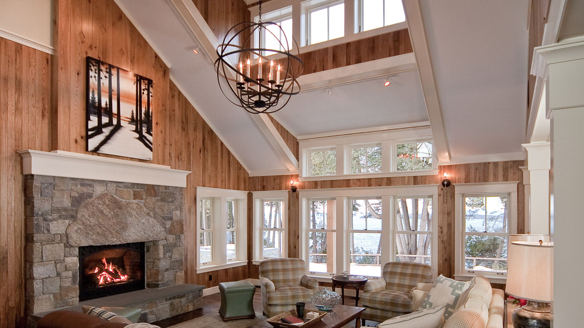 Lake Champlain Vermont vaulted ceiling living room with stone fireplace